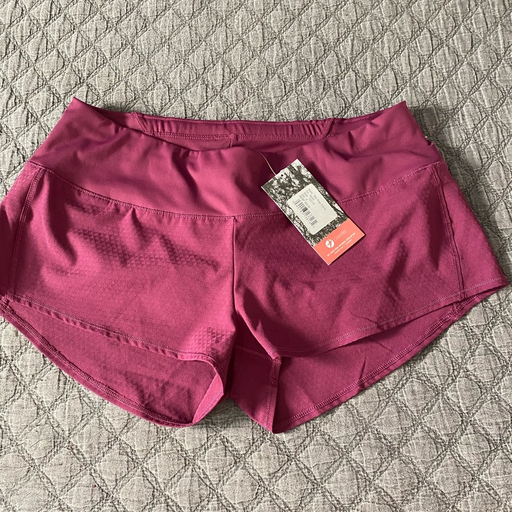 Oiselle new with tags size 6 Mac Roga shorts. Color: queen